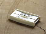 Vintage razor blade dispenser.